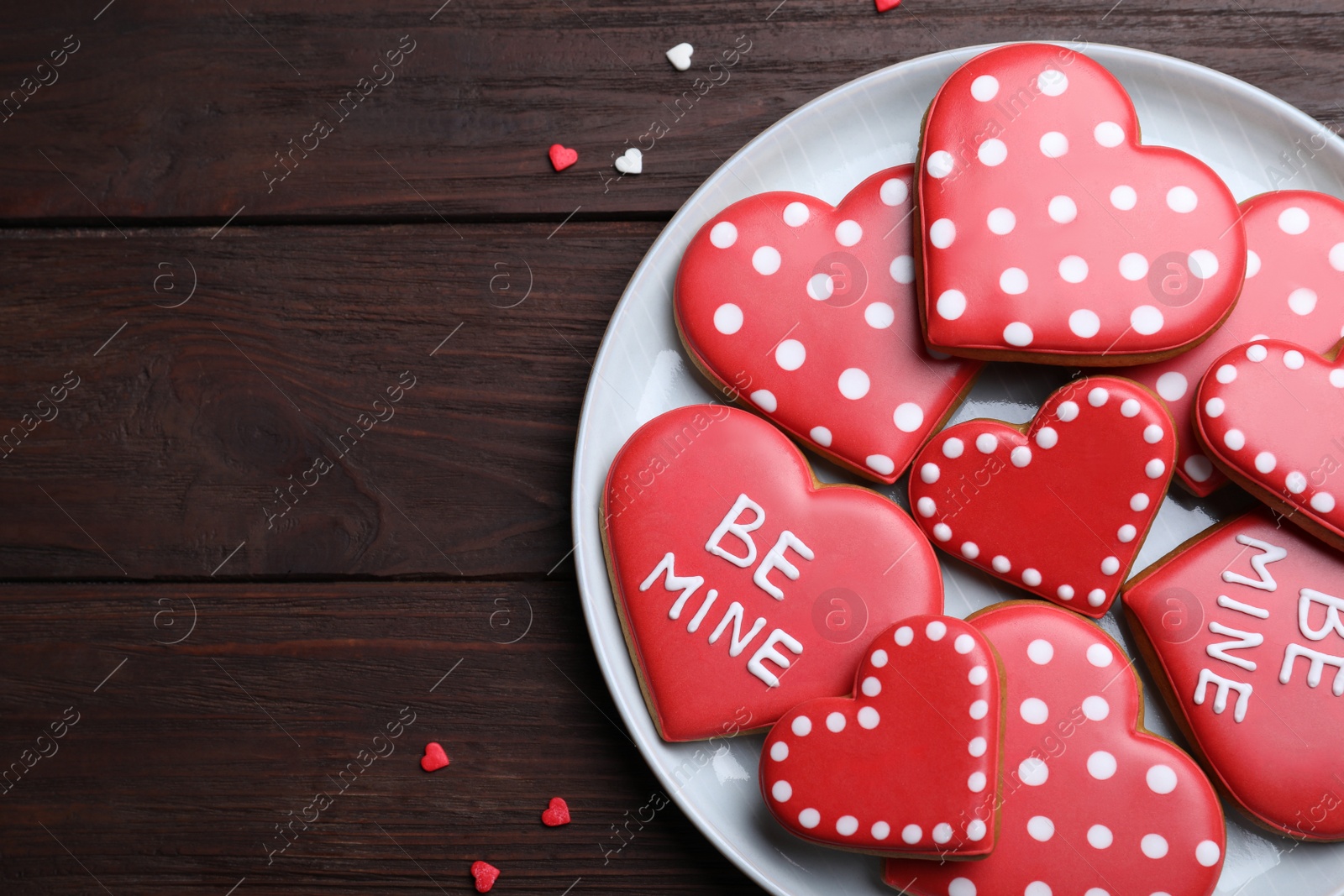 Photo of Heart shaped cookies on wooden table, flat lay with space for text. Valentine's day treat