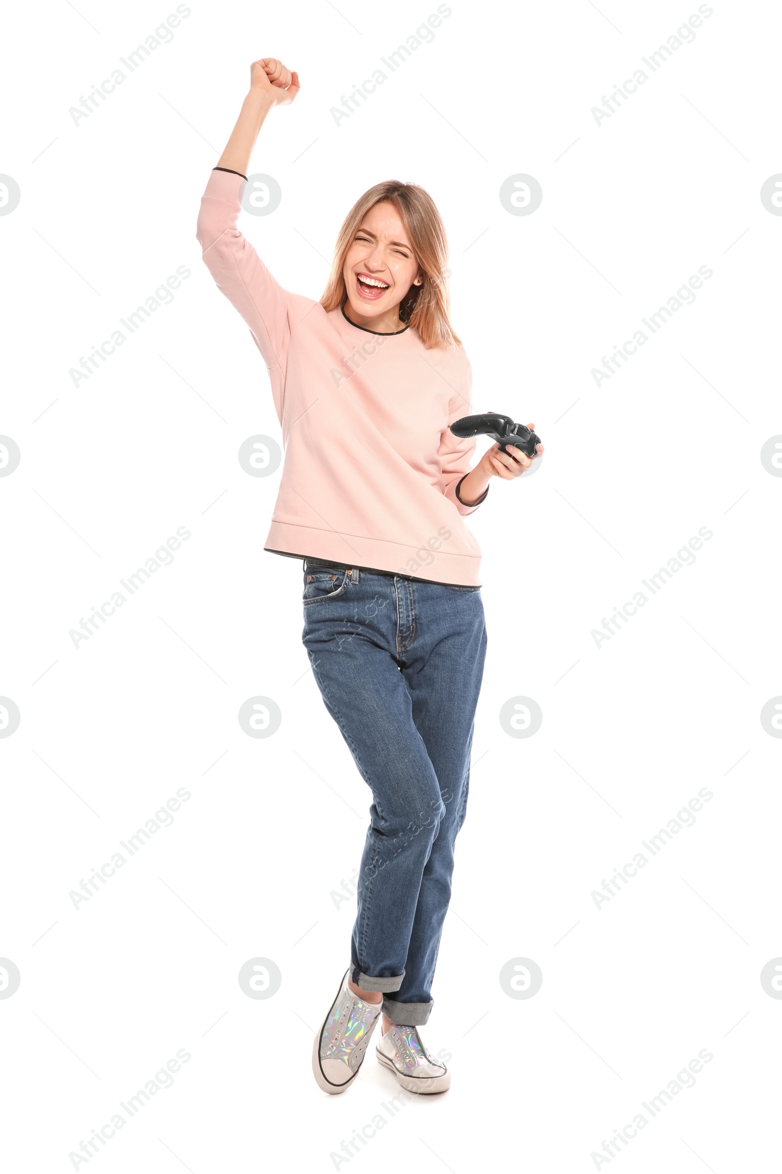 Photo of Emotional young woman playing video games with controller isolated on white