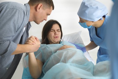 Photo of Woman giving child birth in maternity hospital