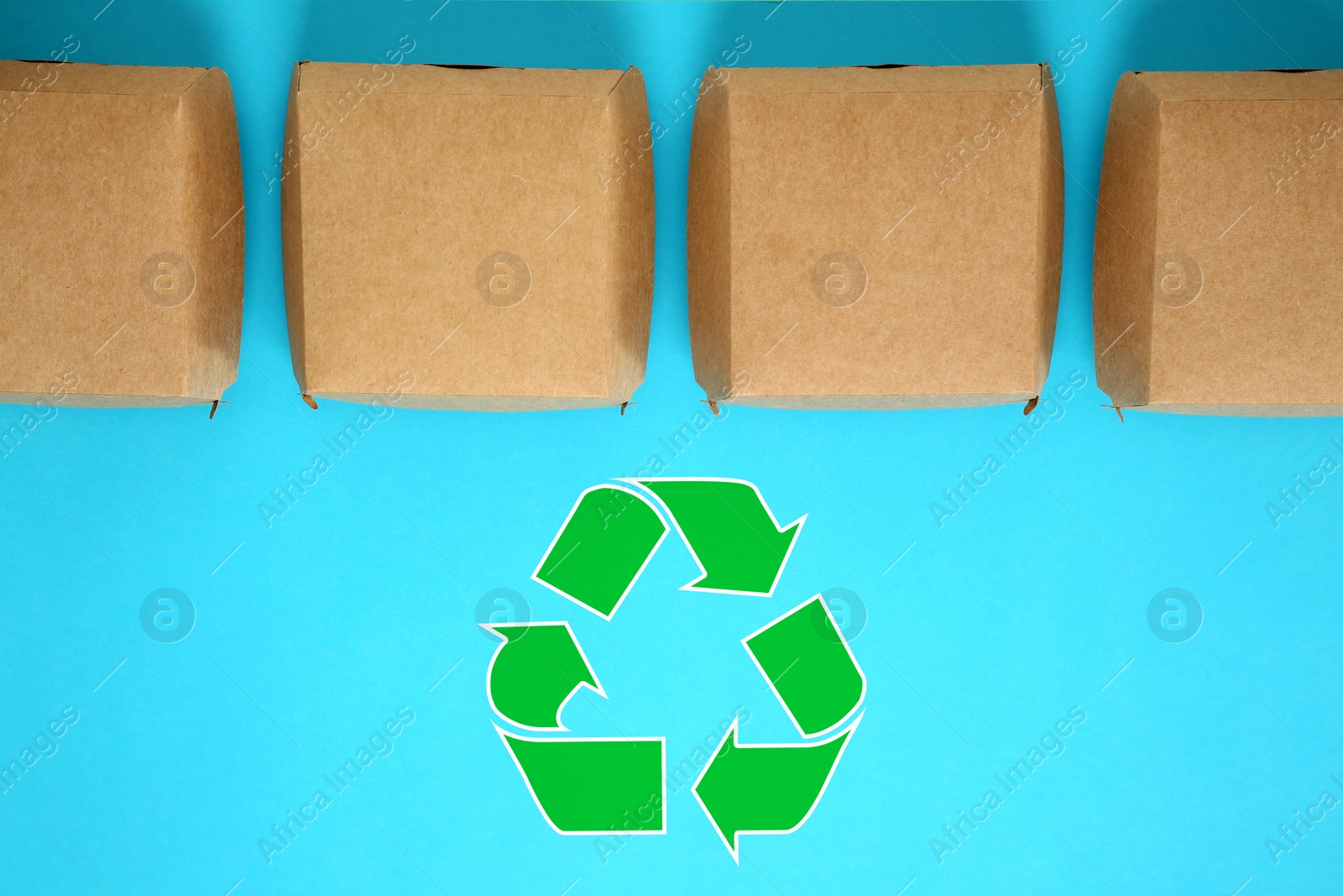 Image of Paper boxes and recycling symbol on turquoise background, flat lay