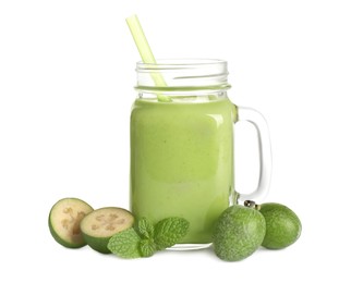 Photo of Fresh feijoa smoothie in mason jar and fresh fruits on white background