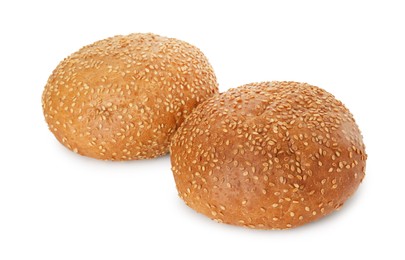 Two fresh hamburger buns with sesame seeds isolated on white