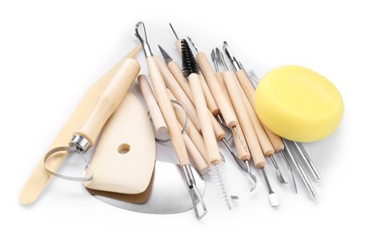 Photo of Set of different clay crafting tools isolated on white