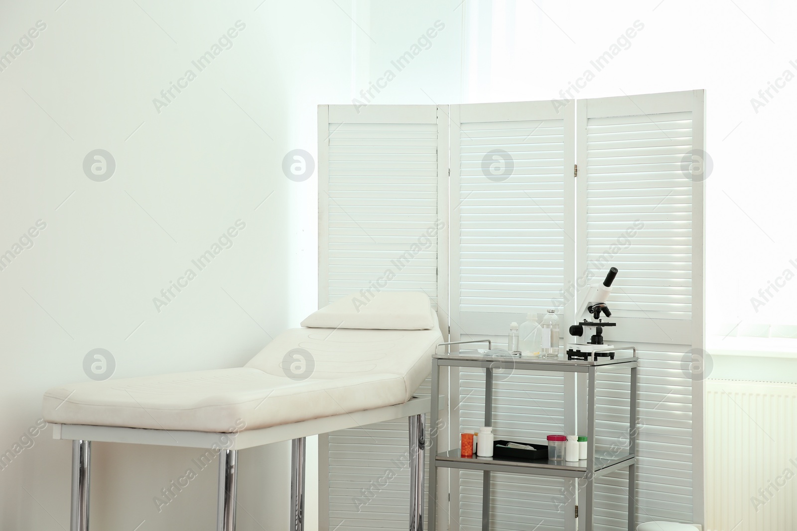 Photo of Interior of modern medical office. Doctor's workplace