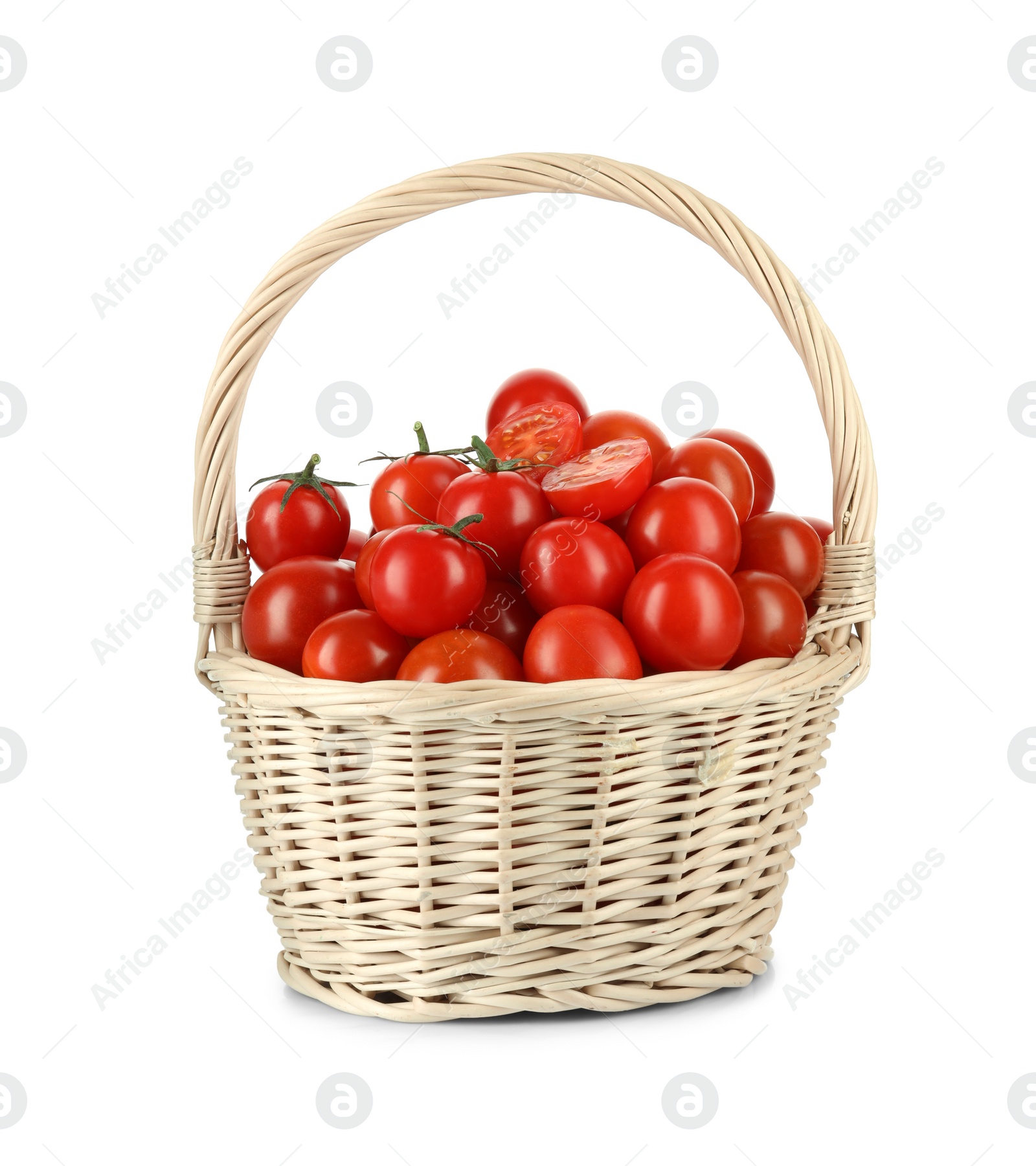 Wicker basket with fresh ripe cherry tomatoes isolated on white Photo of Wicker basket with fresh ripe cherry tomatoes isolated on white