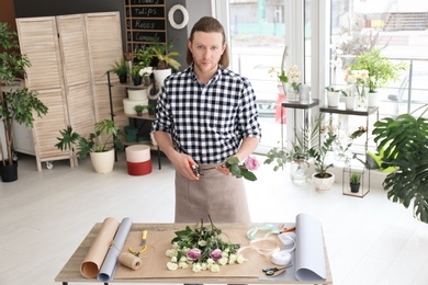 Handsome male florist at workplace