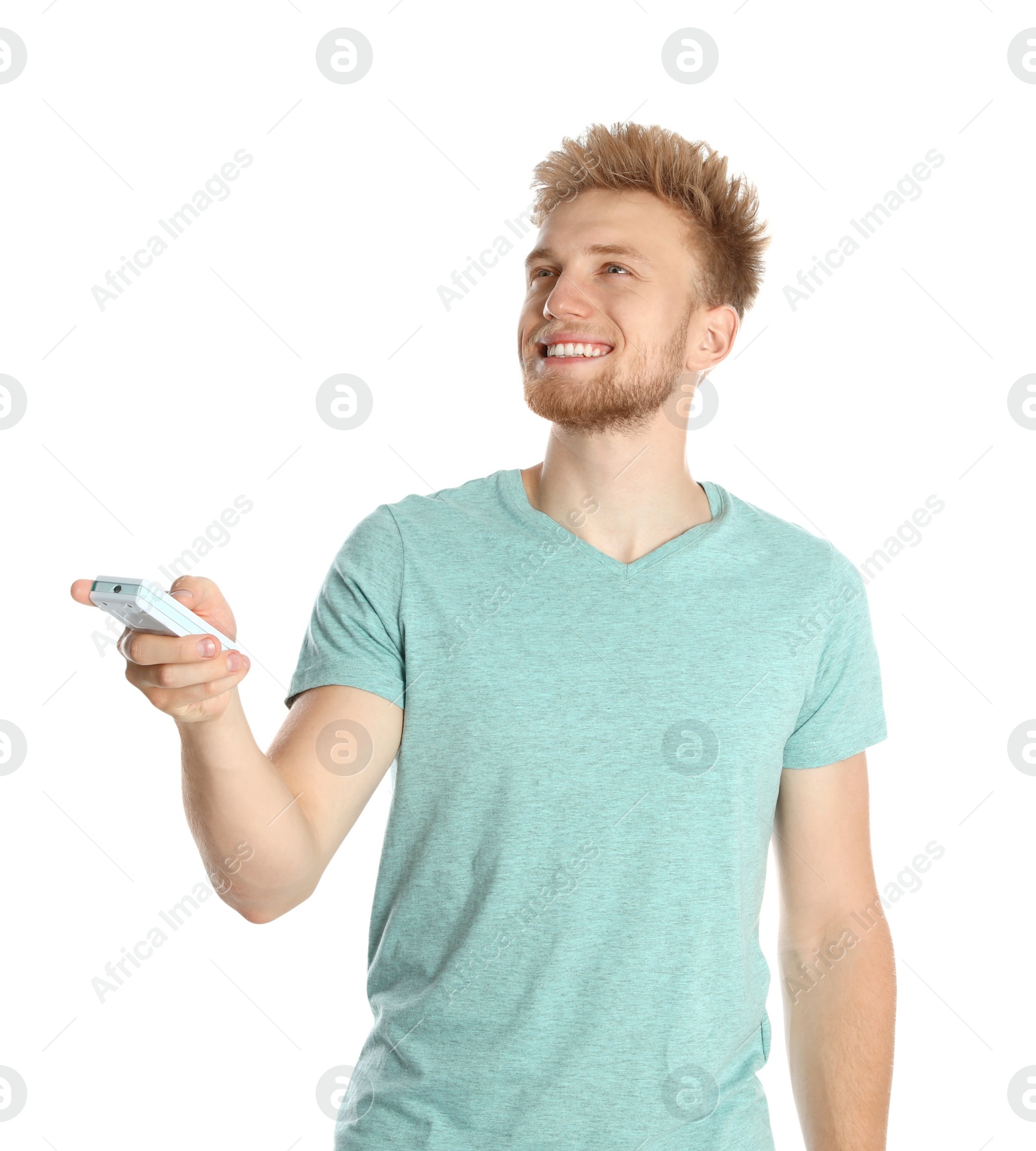 Photo of Young man with air conditioner remote on white background