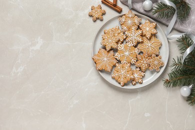 Photo of Tasty Christmas cookies and festive decor on light grey table, flat lay. Space for text
