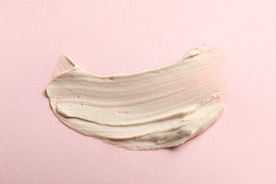 Photo of Sample of face mask on pink background, top view