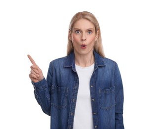 Photo of Surprised woman pointing at something on white background