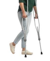 Woman with crutches on white background, closeup