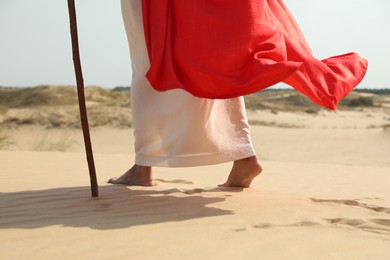 Jesus Christ walking in desert, closeup view