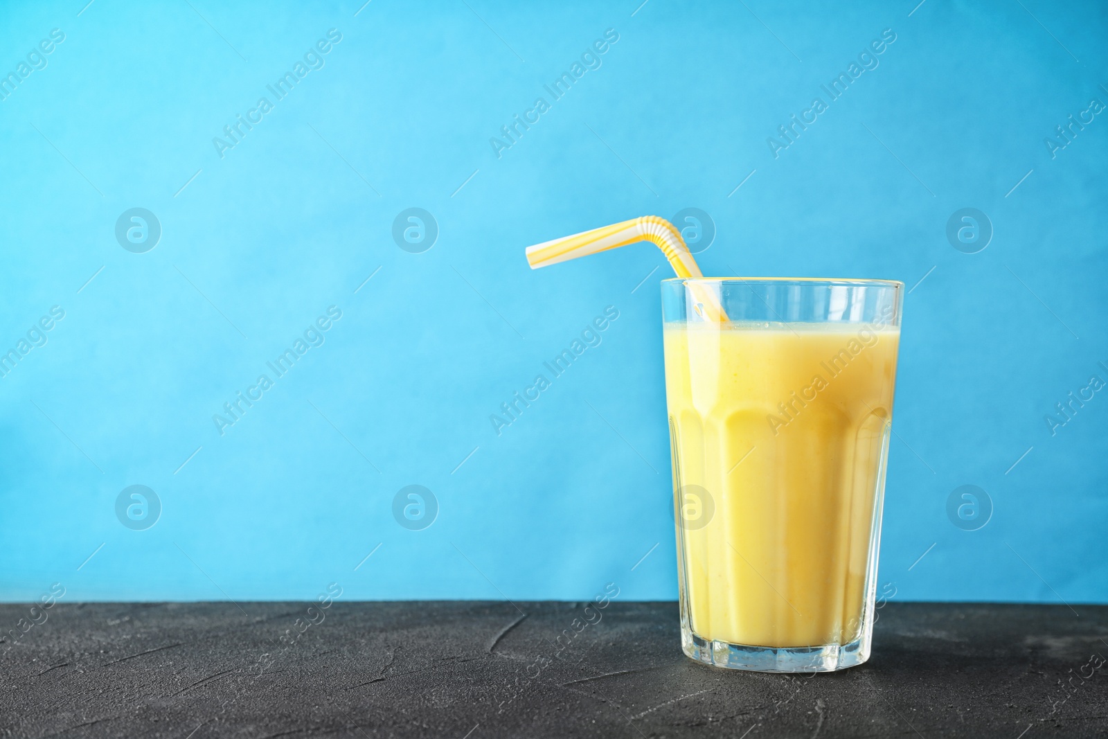 Photo of Glass with delicious detox smoothie on table