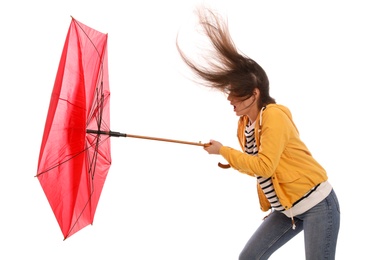 Photo of Woman with umbrella caught in gust of wind on white background