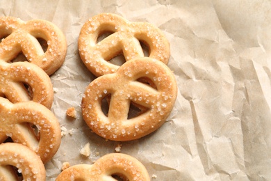 Photo of Tasty Danish butter cookies on paper background, top view with space for text