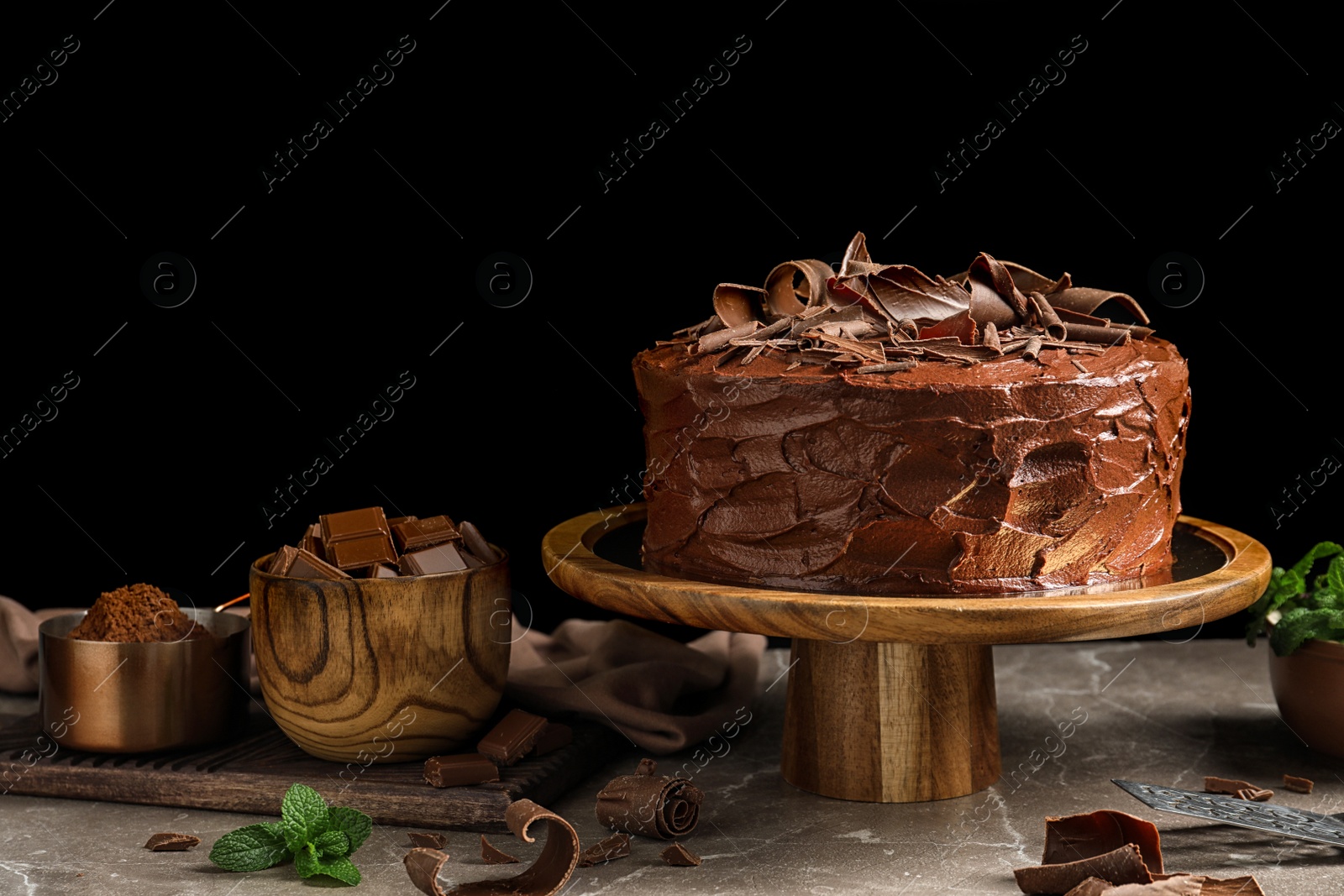 Photo of Composition with tasty homemade chocolate cake on table