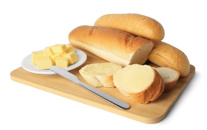 Photo of Whole and cut baguettes with fresh butter on white background