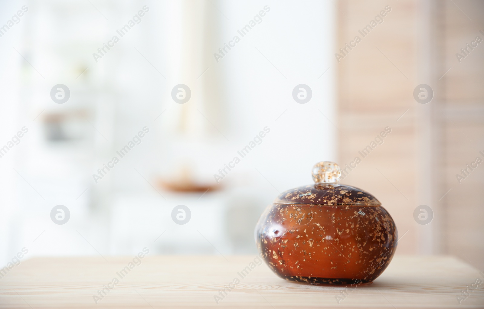 Photo of Small decorative box and blurred bathroom on background