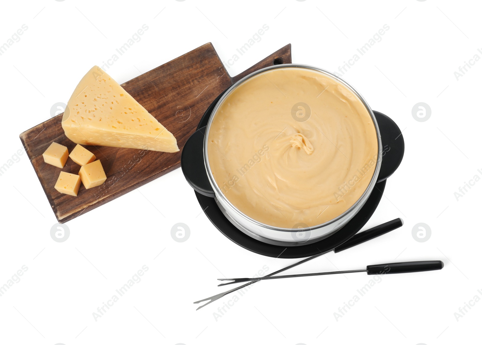 Photo of Fondue with tasty melted cheese, forks and pieces isolated on white, top view