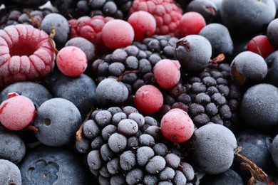 Mix of different frozen berries as background, closeup