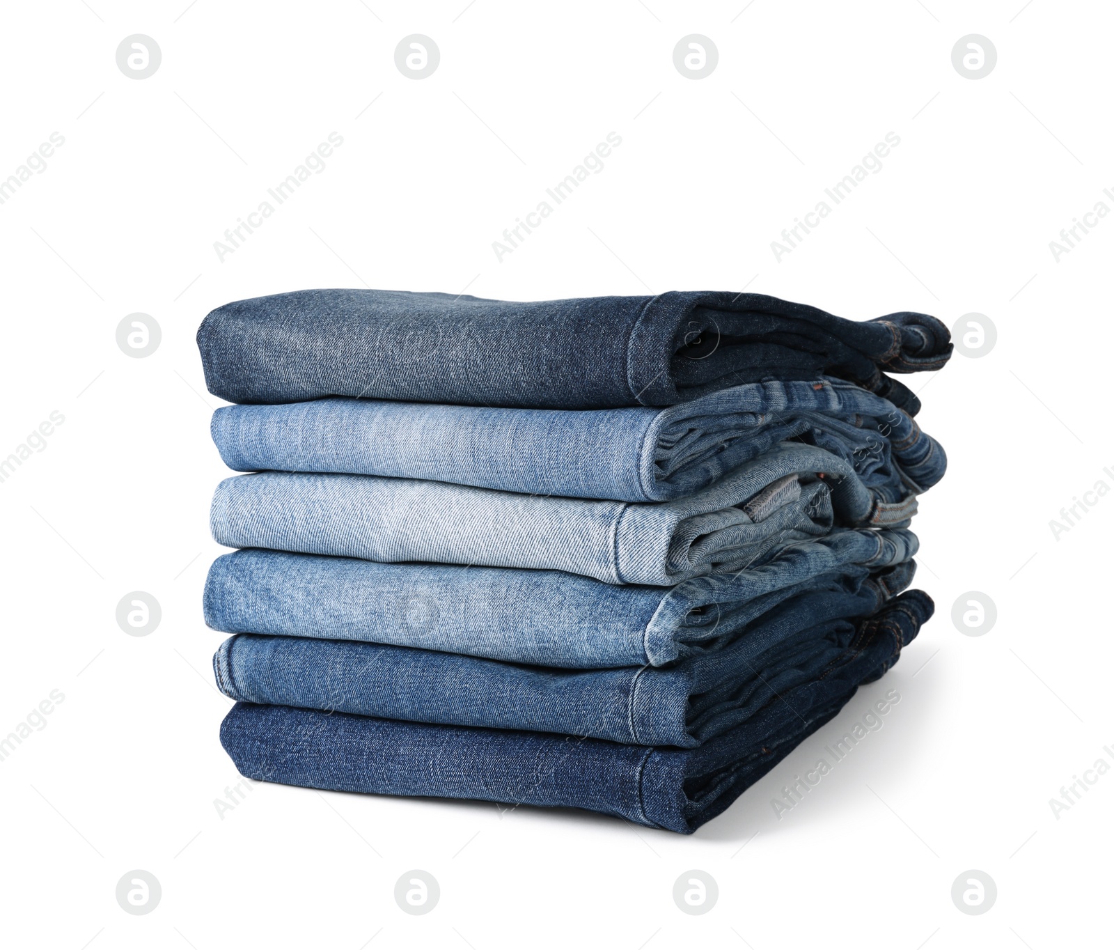 Image of Stack of different folded jeans isolated on white