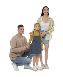 Little girl with her parents together on white background