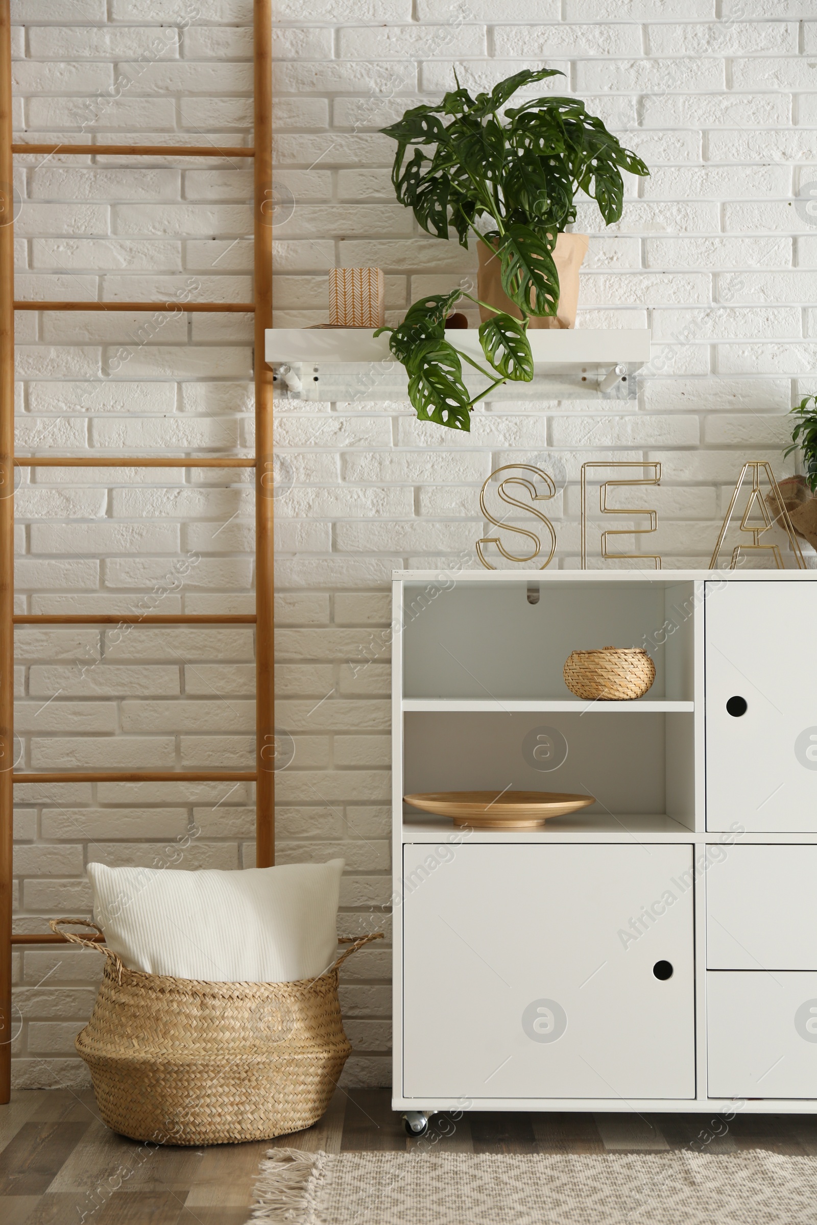 Photo of Chest of drawers in stylish room interior