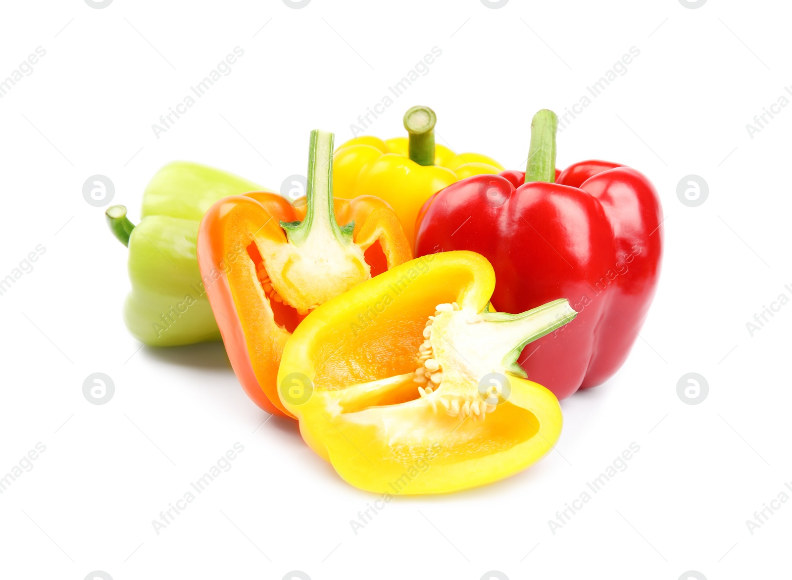 Photo of Whole and cut bell peppers on white background