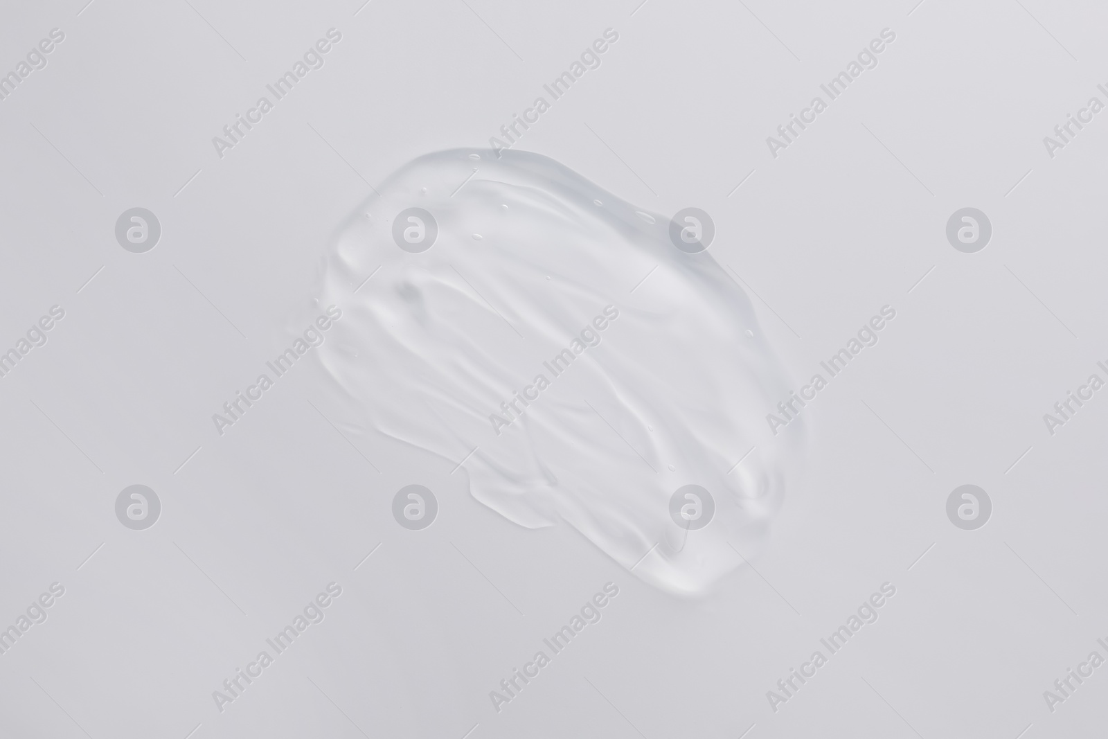 Photo of Sample of transparent gel isolated on white, top view