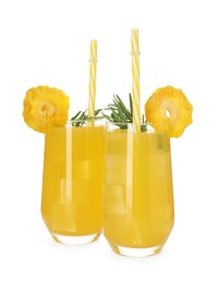 Photo of Glasses of tasty pineapple cocktail with rosemary isolated on white