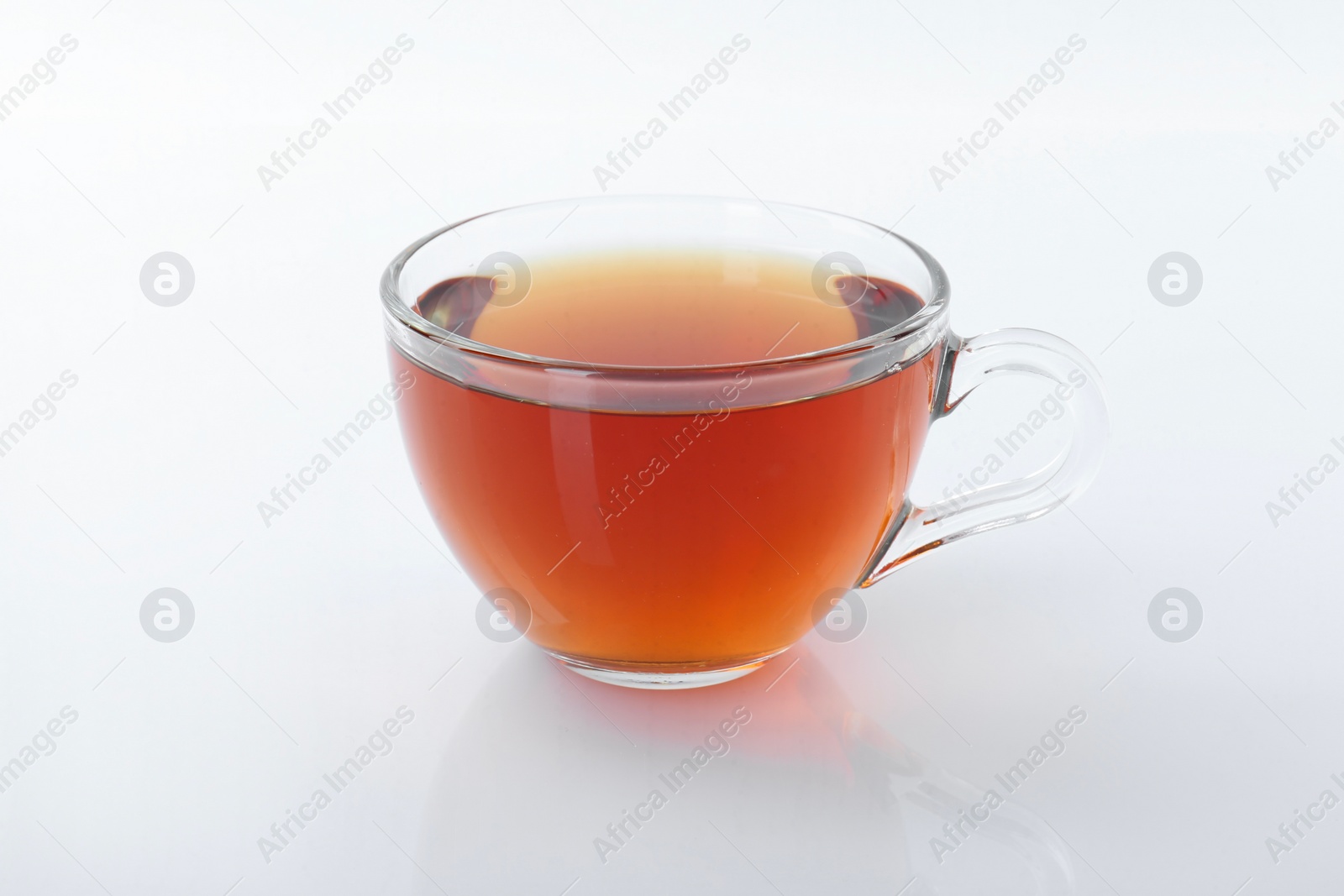 Photo of Tasty tea in cup on white background