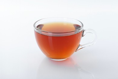 Tasty tea in cup on white background