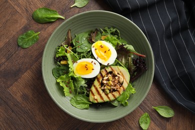 Healthy dish high in vegetable fats on wooden table, top view