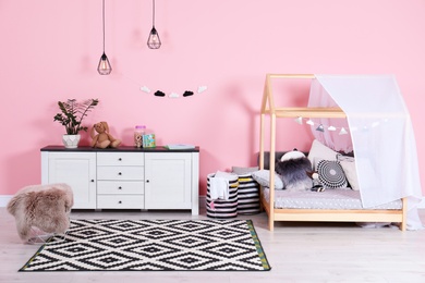 Photo of Modern child's room interior with cute bed