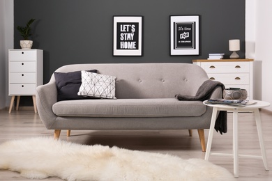 Photo of Cozy living room interior with comfortable sofa