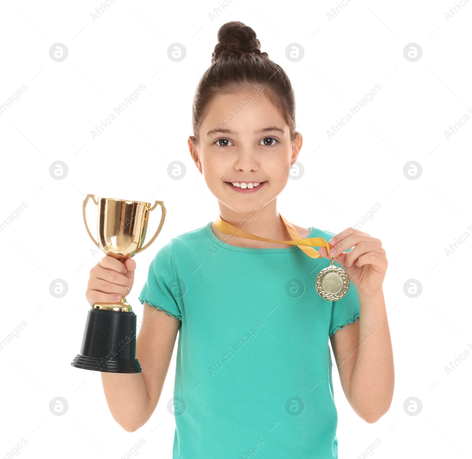 Photo of Happy girl with golden winning cup and medal isolated on white