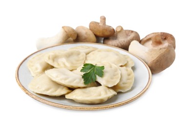 Photo of Delicious dumplings (varenyky) with mushrooms and parsley isolated on white