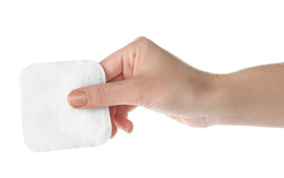 Photo of Woman holding soft clean cotton pad on white background, closeup