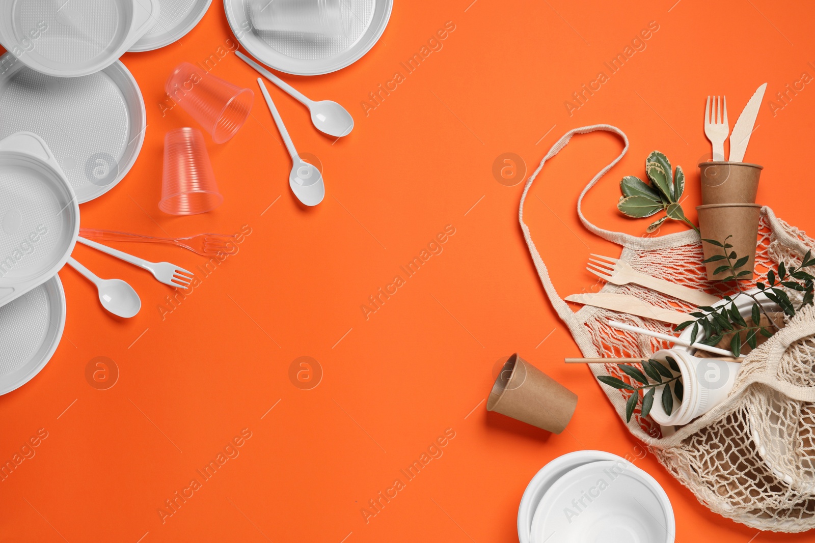 Photo of Flat lay composition with plastic and eco disposable tableware on orange background. Space for text