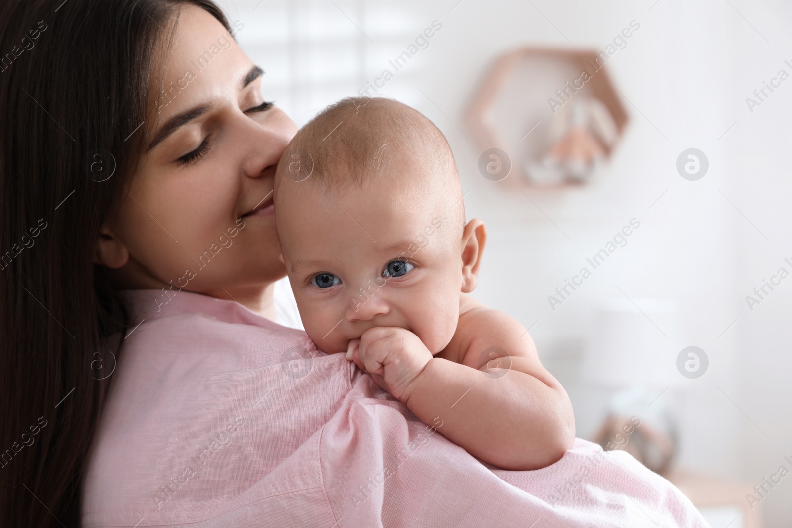 Photo of Mother with her cute baby at home