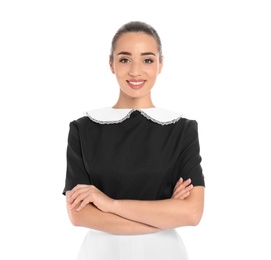 Portrait of young chambermaid in tidy uniform on white background