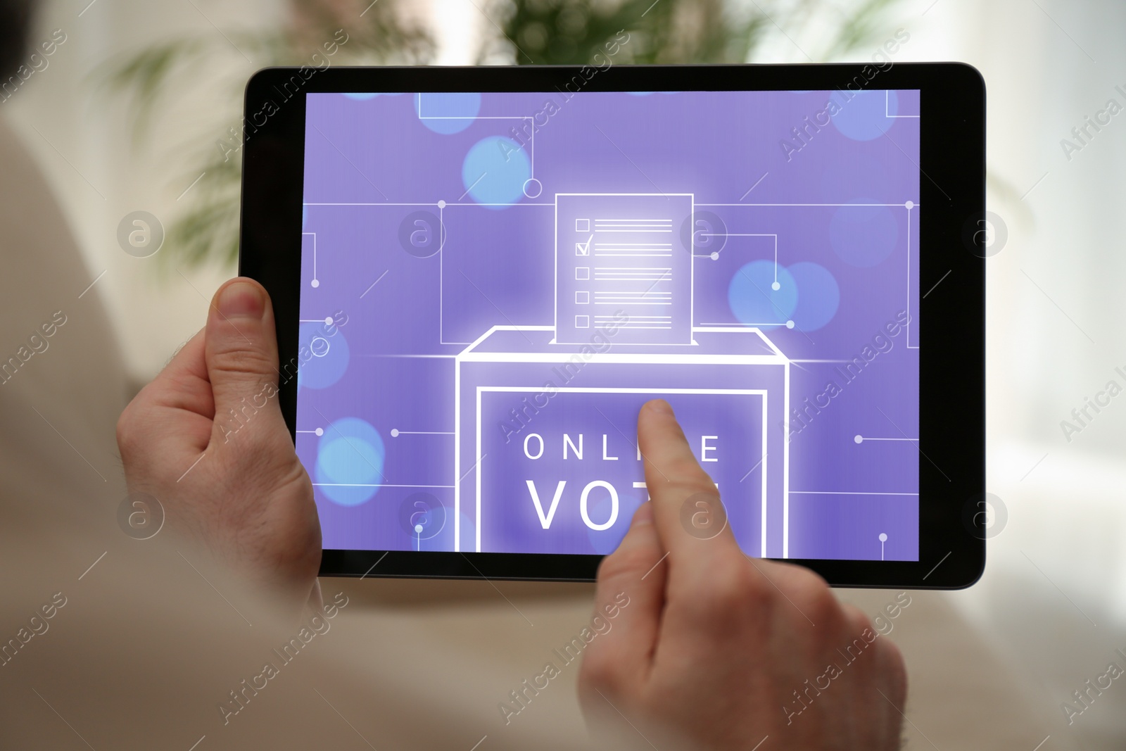 Image of Man voting online via tablet indoors, closeup