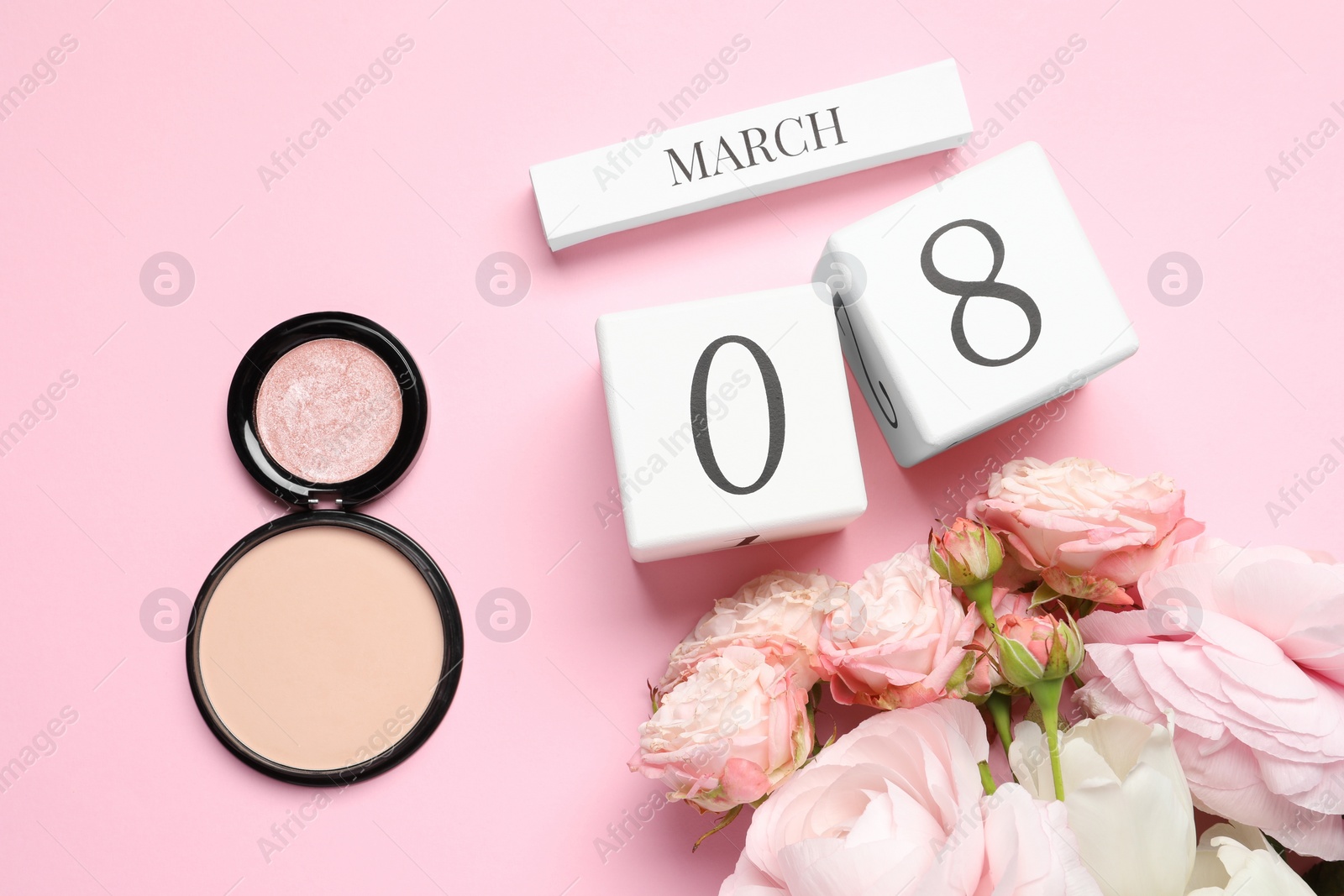 Photo of International Women's day - 8th of March. Cosmetic products, wooden block calendar and beautiful flowers on pink background, flat lay