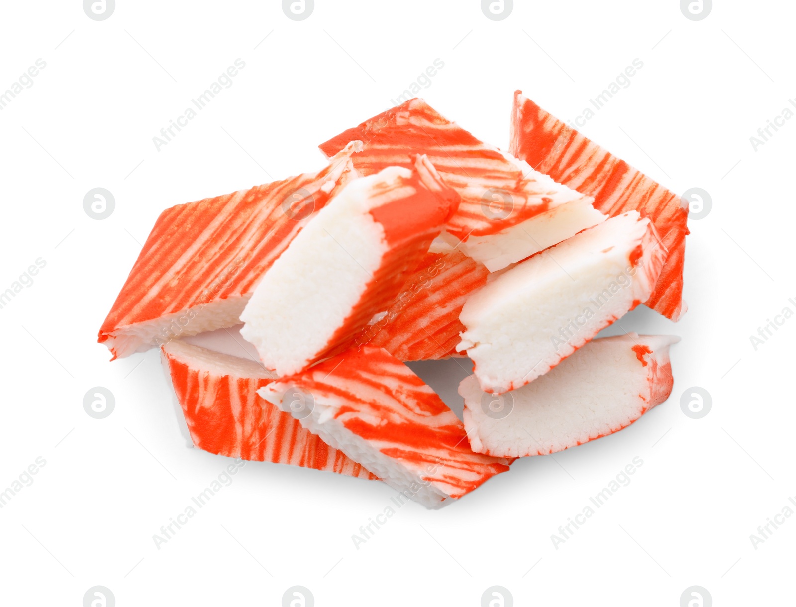 Photo of Pieces of crab sticks isolated on white, top view