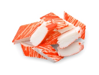 Photo of Pieces of crab sticks isolated on white, top view