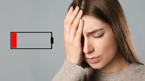Image of Illustration of discharged battery and tired woman on light grey background. Extreme fatigue