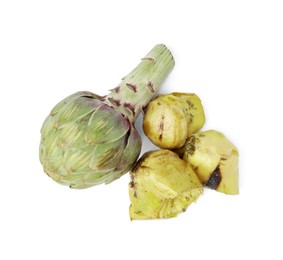 Photo of Delicious pickled artichokes and fresh vegetable on white background, top view