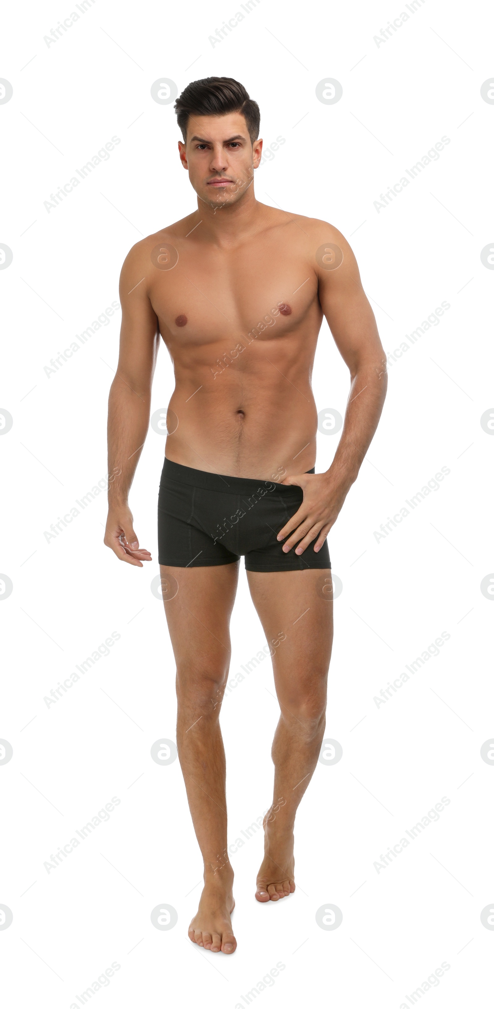 Photo of Handsome man in black underwear on white background