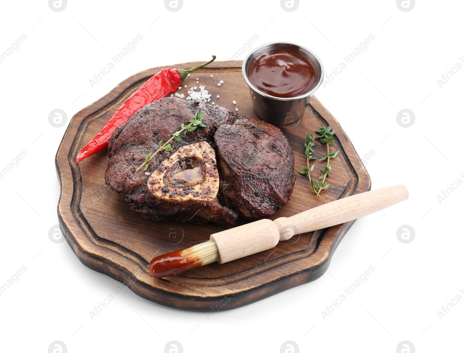 Photo of Delicious roasted beef meat, spices and sauce isolated on white