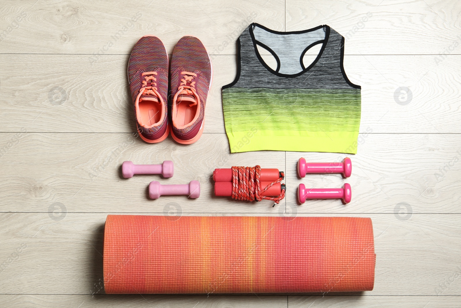 Photo of Set of fitness equipment and accessories on wooden background, flat lay